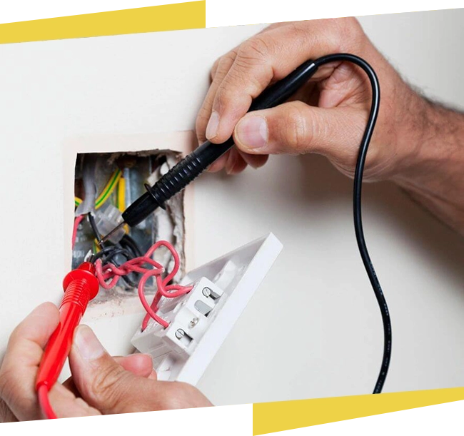 A person is using a pair of scissors to cut the wires.