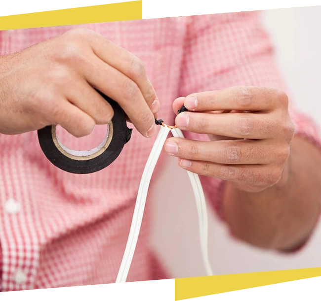 A person holding a pair of scissors and string.